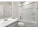 Bright bathroom featuring a shower and tub combination with a sleek, modern sink and vanity at 1204 May Apple Dr, Matthews, NC 28104