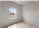 Bedroom with neutral carpet, light gray walls and window overlooking exterior at 1204 May Apple Dr, Matthews, NC 28104