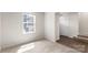 Comfortable bedroom with cozy carpet, natural light streaming through the window, and a versatile space at 1204 May Apple Dr, Matthews, NC 28104