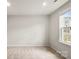 Cozy carpeted bedroom filled with natural light from the window, offering a blank canvas for personalization at 1204 May Apple Dr, Matthews, NC 28104