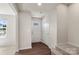 Inviting entryway featuring stylish flooring, ample natural light, and a welcoming front door at 1204 May Apple Dr, Matthews, NC 28104