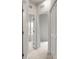 Hallway with neutral carpet leading to bedroom with open door and closet at 1204 May Apple Dr, Matthews, NC 28104