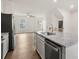 Modern kitchen features a granite countertop island with stainless steel appliances and an open floor plan at 1204 May Apple Dr, Matthews, NC 28104