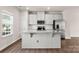 Kitchen features an island with granite countertop and stainless steel appliances at 1204 May Apple Dr, Matthews, NC 28104