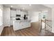 Kitchen with white cabinets, stainless appliances and island at 1204 May Apple Dr, Matthews, NC 28104