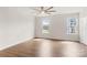 Sun-filled living room with hardwood floors and two windows at 1204 May Apple Dr, Matthews, NC 28104