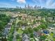 Stunning aerial view of a residential community with the city skyline in the background at 1228 Rising Oak Dr, Charlotte, NC 28206