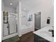 Bright bathroom with a glass-enclosed shower, soaking tub, and modern fixtures at 1228 Rising Oak Dr, Charlotte, NC 28206