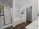 Spacious bathroom with a glass-enclosed shower, soaking tub, and neutral color palette at 1228 Rising Oak Dr, Charlotte, NC 28206