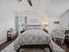 Inviting bedroom featuring a queen-sized bed, ceiling fan, and neutral decor at 1228 Rising Oak Dr, Charlotte, NC 28206