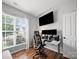 Office space with hardwood floors, and a large window for natural light and ventilation at 1228 Rising Oak Dr, Charlotte, NC 28206