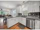 Well-lit kitchen features stainless steel appliances, granite countertops, and easy access to the dining and living areas at 1228 Rising Oak Dr, Charlotte, NC 28206