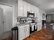 Open kitchen with granite countertops, stainless steel appliances, and hardwood flooring at 1228 Rising Oak Dr, Charlotte, NC 28206