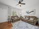Bright living area with hardwood floors, comfortable seating, and a large window providing ample natural light at 1228 Rising Oak Dr, Charlotte, NC 28206