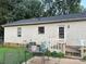 Home exterior with a small deck and views of the yard and garden at 1250 Landsdowne Dr, Conover, NC 28613