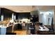View of an eat-in kitchen with black cabinets and stainless steel appliances at 1250 Landsdowne Dr, Conover, NC 28613