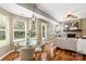 Inviting living area with hardwood floors, fireplace, and access to the outdoor space at 13010 Indian Hills Ln, Charlotte, NC 28278