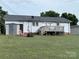 A view of the back of the house, the lawn, and a storage shed at 1314 Hathcock Ave, Albemarle, NC 28001
