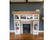Stylish fireplace featuring built-in shelving and natural wood mantle, adding warmth to the living space at 1314 Hathcock Ave, Albemarle, NC 28001