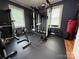 Home gym features rubber flooring, weightlifting equipment and natural light from the windows at 1314 Hathcock Ave, Albemarle, NC 28001
