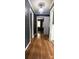 Hallway featuring pristine hardwood flooring, and freshly painted trim and walls at 1314 Hathcock Ave, Albemarle, NC 28001