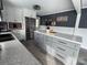 Updated kitchen boasting sleek appliances, island with storage, and modern vinyl flooring at 1314 Hathcock Ave, Albemarle, NC 28001