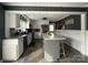 Well-lit, modern kitchen with gray island, stainless steel appliances and white cabinets at 1314 Hathcock Ave, Albemarle, NC 28001