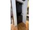 A laundry closet featuring a black stacked washer and dryer tucked behind white doors at 1314 Hathcock Ave, Albemarle, NC 28001
