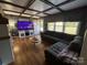 Comfortable living room featuring coffered ceilings, hardwood floors, and large sectional sofa at 1314 Hathcock Ave, Albemarle, NC 28001