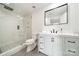 Modern bathroom boasts a glass shower, decorative tile floor, and a white vanity at 1315 East Blvd # 327, Charlotte, NC 28203