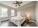 Bright bedroom with ample natural light, modern ceiling fan, and neutral decor at 1315 East Blvd # 327, Charlotte, NC 28203