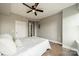 Relaxing bedroom showcases hardwood floors and a modern ceiling fan, offering comfort at 1315 East Blvd # 327, Charlotte, NC 28203