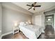 Comfortable bedroom featuring hardwood floors and a ceiling fan, creating a relaxing atmosphere at 1315 East Blvd # 327, Charlotte, NC 28203