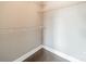 Spacious walk-in closet features wire shelving and hardwood floors, providing ample storage at 1315 East Blvd # 327, Charlotte, NC 28203