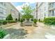 Picturesque courtyard offering lush landscaping, benches, and a tranquil retreat for residents at 1315 East Blvd # 327, Charlotte, NC 28203