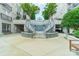 This courtyard water feature flows down a set of stairs in front of the covered parking garage at 1315 East Blvd # 327, Charlotte, NC 28203