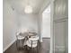 Cozy dining area with modern chandelier, round table, and seating for four at 1315 East Blvd # 327, Charlotte, NC 28203