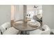 Dining area view with table setting, stylish chairs, and open concept living space at 1315 East Blvd # 327, Charlotte, NC 28203