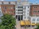 Condo building featuring brick and modern architecture with a prominent entrance under 'The Dilworth' sign at 1315 East Blvd # 327, Charlotte, NC 28203