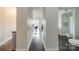 Bright and spacious hallway leading to the living area with hardwood floors at 1315 East Blvd # 327, Charlotte, NC 28203