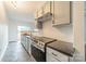 Stylish kitchen featuring stainless steel appliances, granite counters, and ample cabinet space at 1315 East Blvd # 327, Charlotte, NC 28203