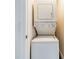 Convenient laundry area features stacked washer and dryer appliances for easy care at 1315 East Blvd # 327, Charlotte, NC 28203