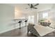 A comfy living room featuring hardwood floors, stylish bar stools, and lots of sunlight at 1315 East Blvd # 327, Charlotte, NC 28203