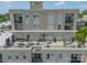 View of condo rooftop deck with patio furniture and lounge chairs at 1315 East Blvd # 327, Charlotte, NC 28203
