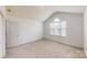 Bright bedroom with vaulted ceilings, window, and ample natural light at 15280 Leslie Brook Rd, Huntersville, NC 28078