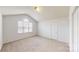 Bedroom with a large window, carpet, and vaulted ceilings at 15280 Leslie Brook Rd, Huntersville, NC 28078