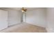 Spacious bedroom with neutral carpet and a ceiling fan at 15280 Leslie Brook Rd, Huntersville, NC 28078