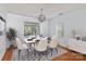 Cozy dining space with contemporary furnishings, wood floors, and bright natural light at 15280 Leslie Brook Rd, Huntersville, NC 28078