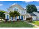 Charming two-story home with a well-manicured lawn, blue shutters, and an attached garage at 15280 Leslie Brook Rd, Huntersville, NC 28078