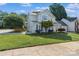 Lovely two-story house with a blue door, an attached garage, and a well-kept lawn at 15280 Leslie Brook Rd, Huntersville, NC 28078